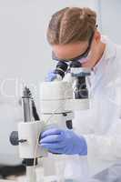 Scientist examining something with the microscope