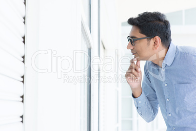 Man looking through the window