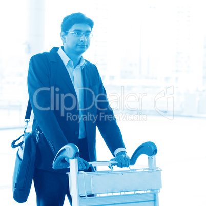 Man walking with airport trolley