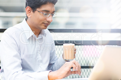 Man enjoying hot milk tea outdoor