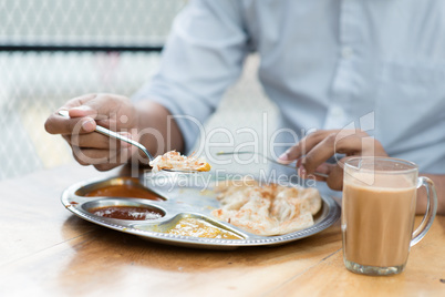 Man having Indian meal