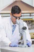 Scientist examining something with the microscope