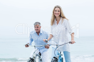 Happy couple cycling together