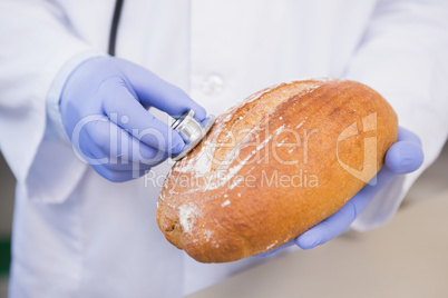 Scientist listening to bread