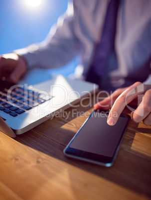 Businessman using laptop at desk