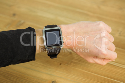 Businesswoman with smart watch on wrist