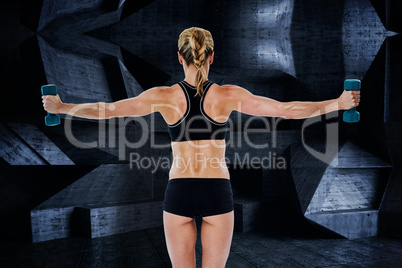 Composite image of female bodybuilder holding two dumbbells with