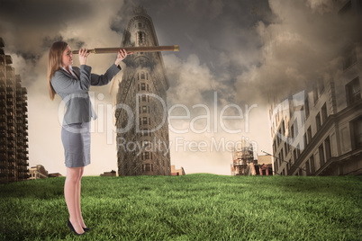 Composite image of businesswoman looking through a telescope