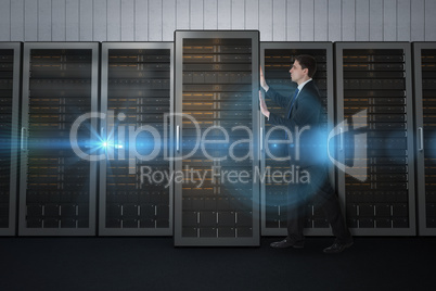 Composite image of businessman in suit pushing