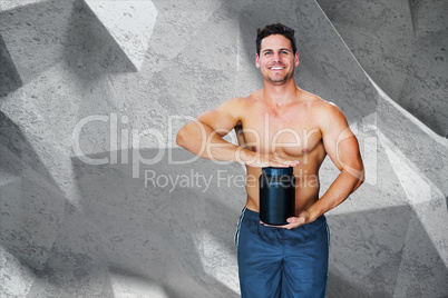 Composite image of bodybuilder with protein powder