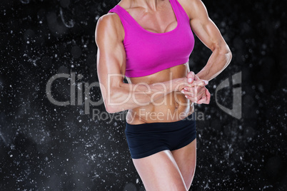 Composite image of female bodybuilder flexing in sports bra and