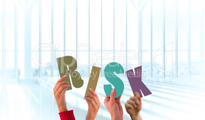 Composite image of hands holding up risk Composite image of hands holding up risk