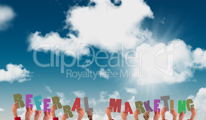 Composite image of hands showing referral marketing