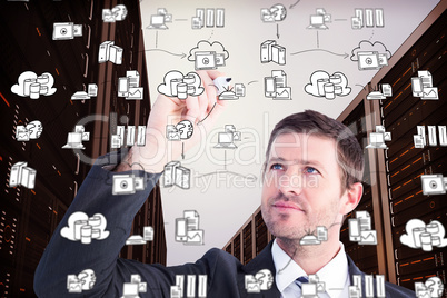 Composite image of serious businessman writing with marker