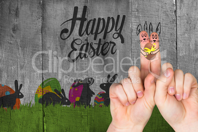 Composite image of fingers as easter bunny