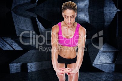 Composite image of female bodybuilder flexing with hands togethe