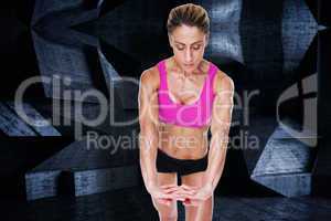 Composite image of female bodybuilder flexing with hands togethe