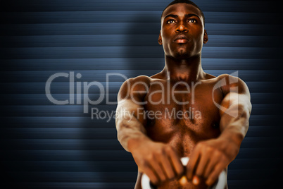 Composite image of shirtless fit young man lifting kettle bell