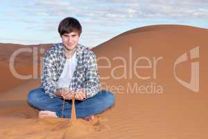 Man alone in the desert on the sand dune