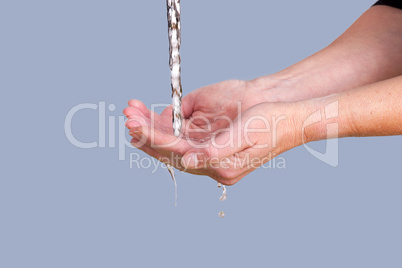 Water running into the hands