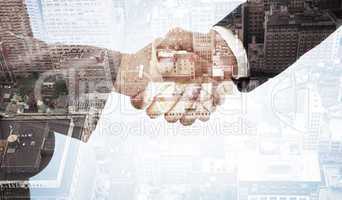 Composite image of handshake between two business people