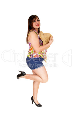 Girl in shorts with straw hat.