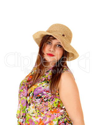 Serious girl with straw hat.