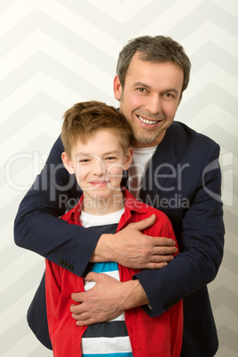 Happy father embracing son