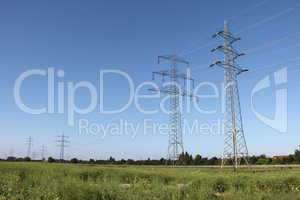 Masts power against the blue sky