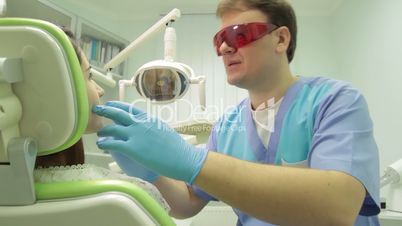 Patient examination at dental clinic