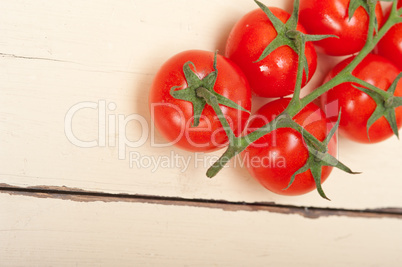 fresh cherry tomatoes on a cluster