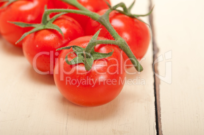 fresh cherry tomatoes on a cluster