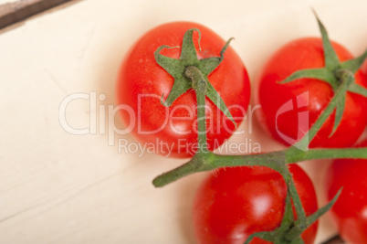 fresh cherry tomatoes on a cluster