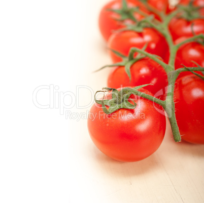 fresh cherry tomatoes on a cluster