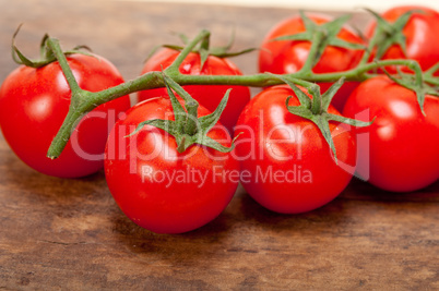 fresh cherry tomatoes on a cluster