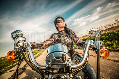 Biker girl on a motorcycle