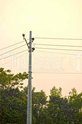 High voltage post tower and power line on sunset sky background for any use.