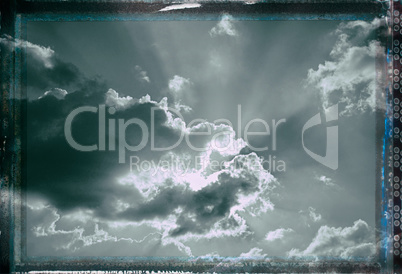 Vintage sky background with dark border and retro texture.