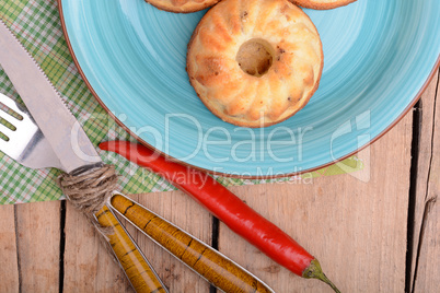 cheese cake on blue plate with red pepper