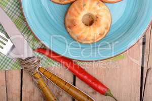 cheese cake on blue plate with red pepper
