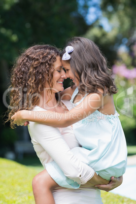 Happy mother and daughter hugging