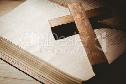 Open bible and wooden cross