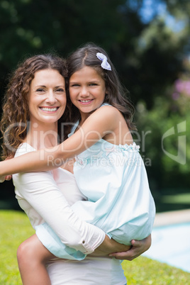 Happy mother and daughter hugging