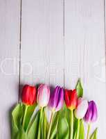 Tulips on wooden table