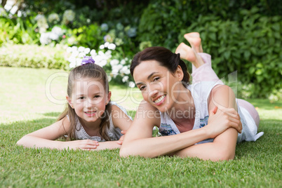 Mother and daughter smiling at camera