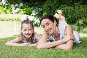 Mother and daughter smiling at camera