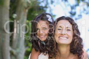 Happy mother and daughter embracing