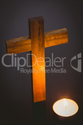 Candle and wooden cross