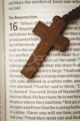 Open bible and wooden cross