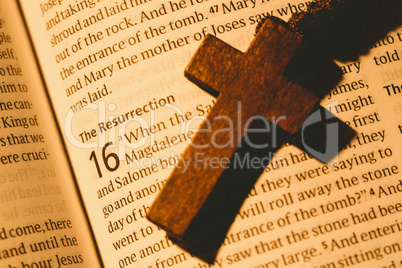 Open bible and wooden cross